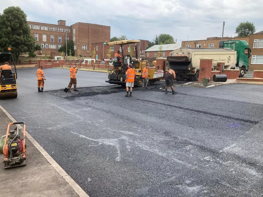 Crew surfacing a large car park