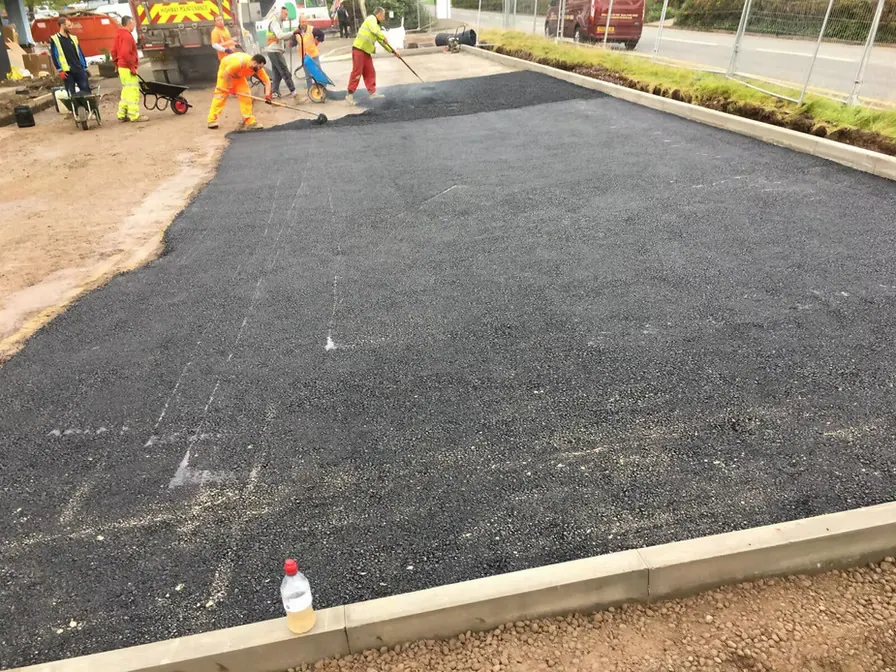 Team laying a large tarmac area