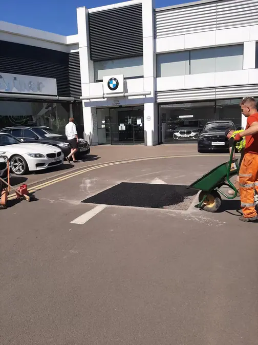 Patch repair outside a car dealership