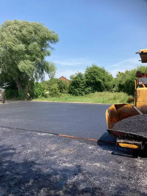 Roller compacting fresh tarmac