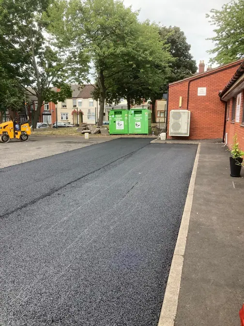 New tarmac drive between buildings