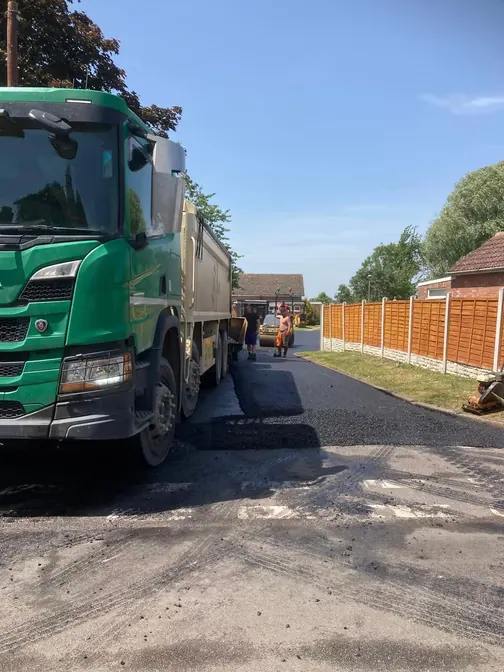 Tipper lorry delivering tarmac