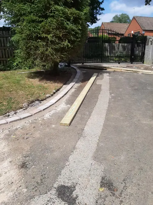 Kerb edging on a new tarmac drive