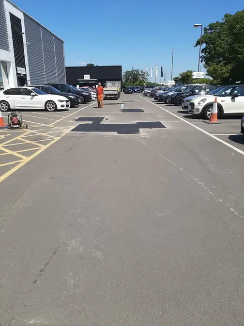 Patch repair strip in a car park