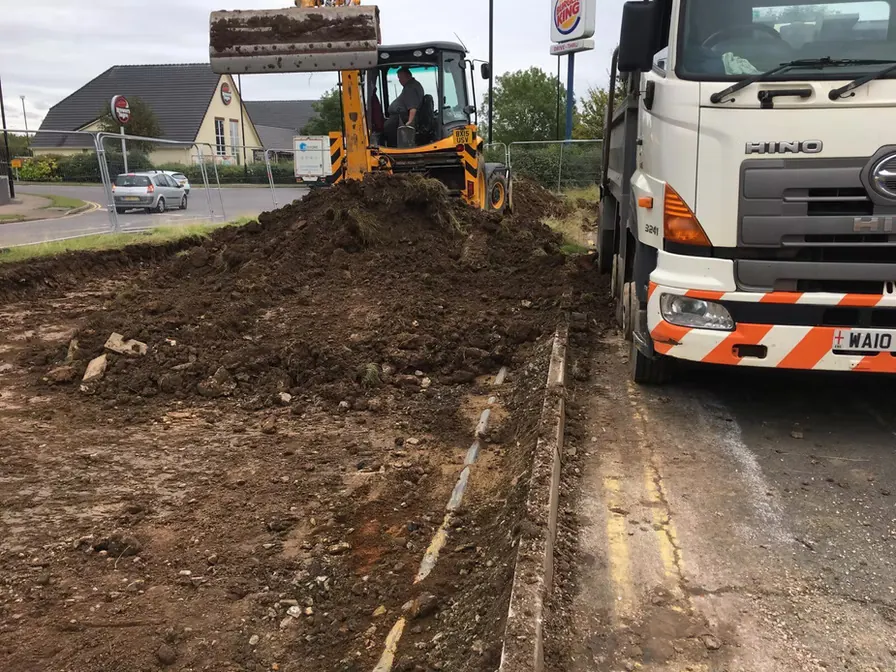 Excavator and lorry on site